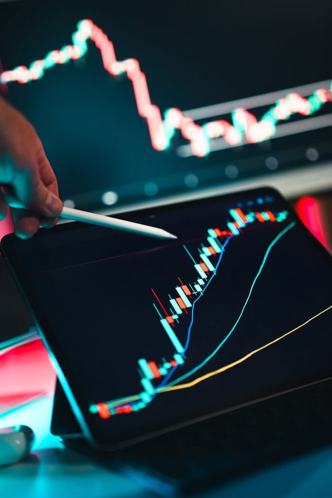 pexels-photo-30572289 Close-up of cryptocurrency trading analysis on a digital tablet, highlighting market trends.